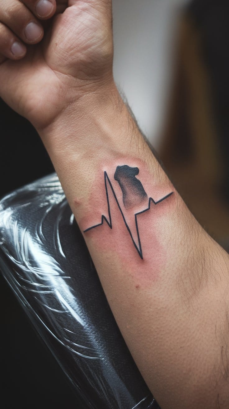 photograph of a forearm tattoo showing a heartbeat line with a golden retriever dog silhouette integrated at the peak, black ink on natural skin, the tattoo is healed and well-done, person's arm resting naturally, soft natural lighting, visible skin pores and texture, professional close-up photography, real tattoo not a mockup, 85mm portrait lens quality