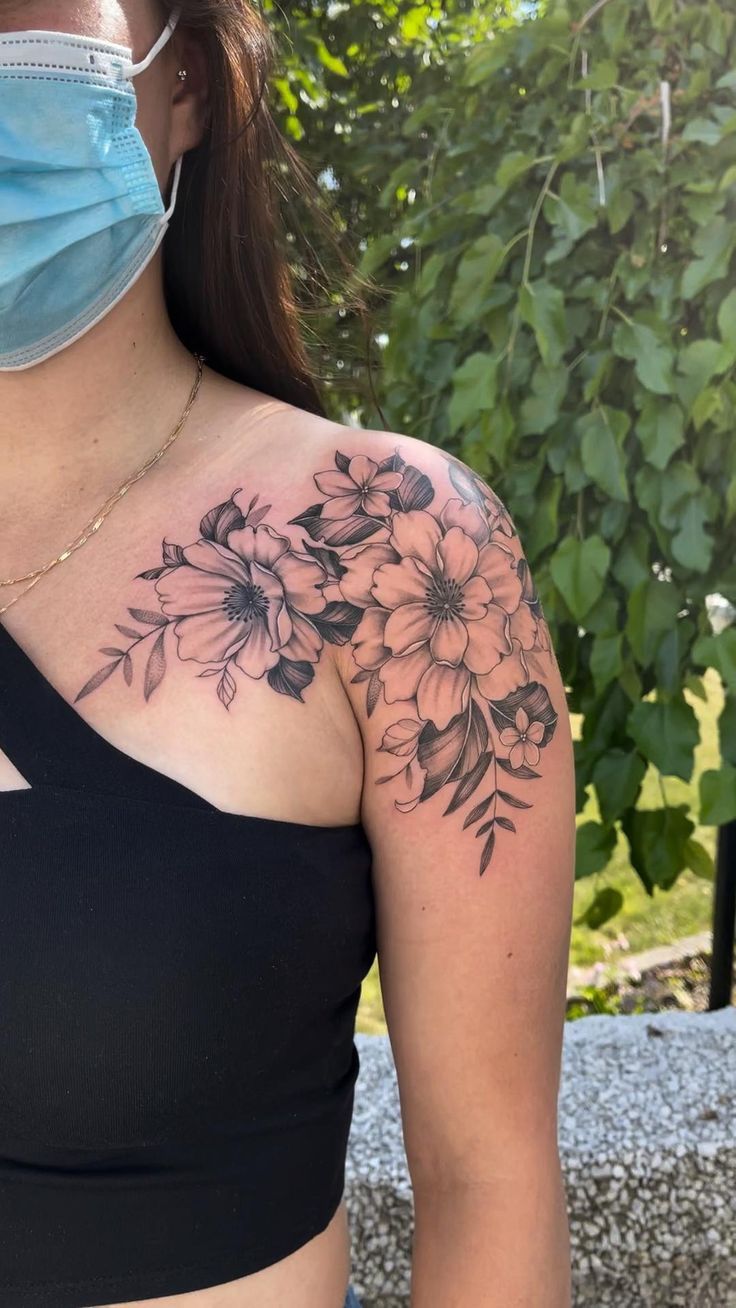 Shoulder Blade Mountain Tattoo with Blossoms