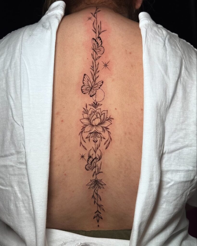 Minimalist Lotus and Sun Symbol Tattoo Spine Tattoos for Women