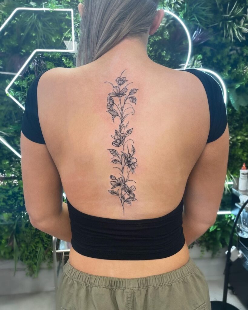 Single Flower with "Everything Happens for a Reason" Tattoo Spine Tattoos for Women