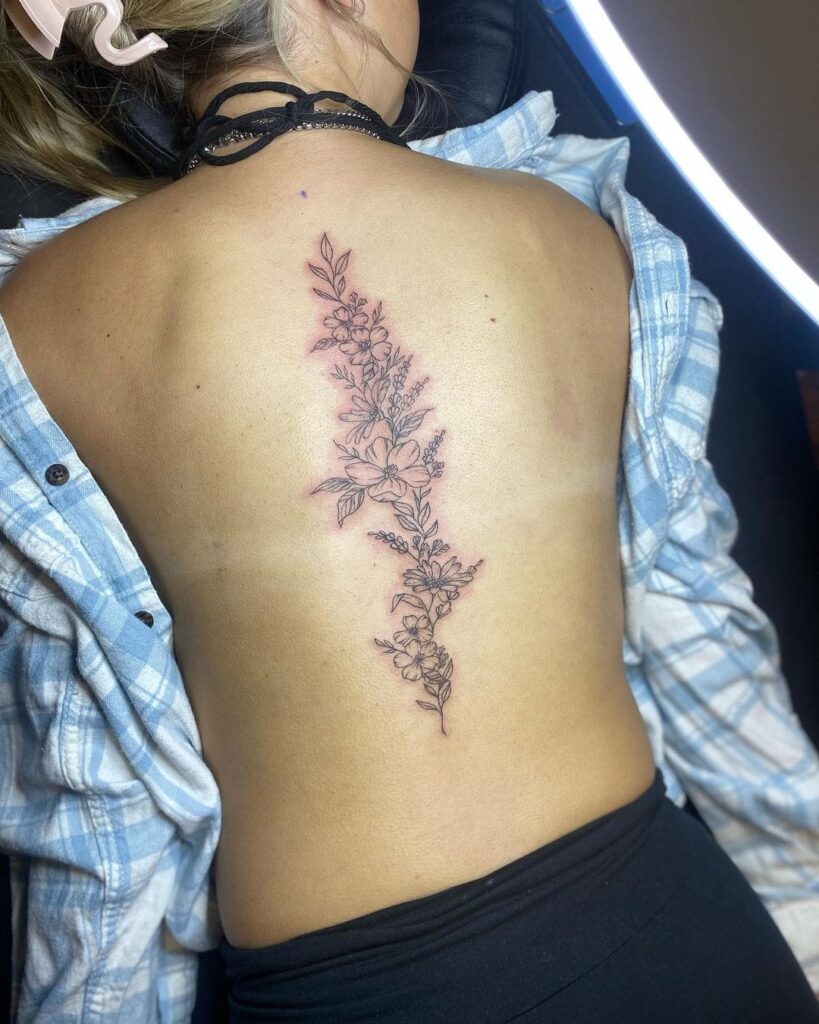 Winged Elegance with Geometric Symbols Tattoo Spine Tattoos for Women