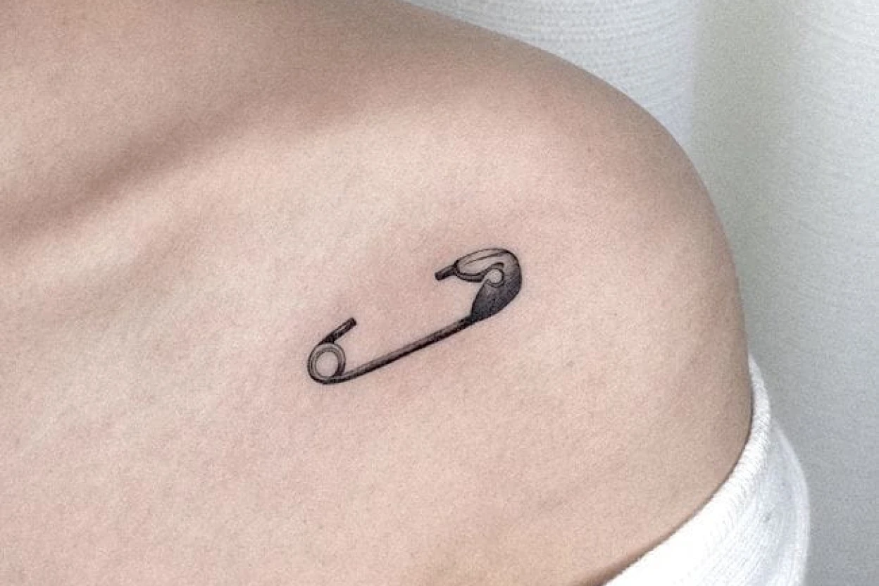 Elegant small chest tattoos featured design and collarbone placement