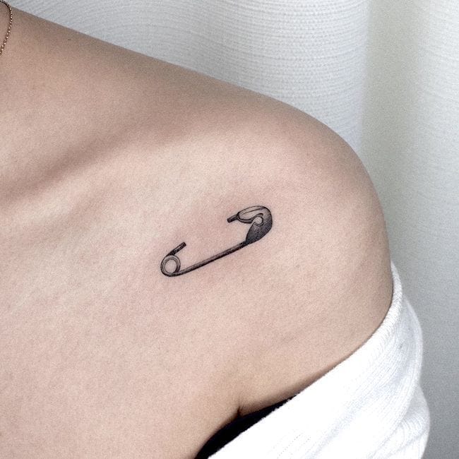 Realistic Safety Pin Statement Tattoo Small Chest Tattoos
