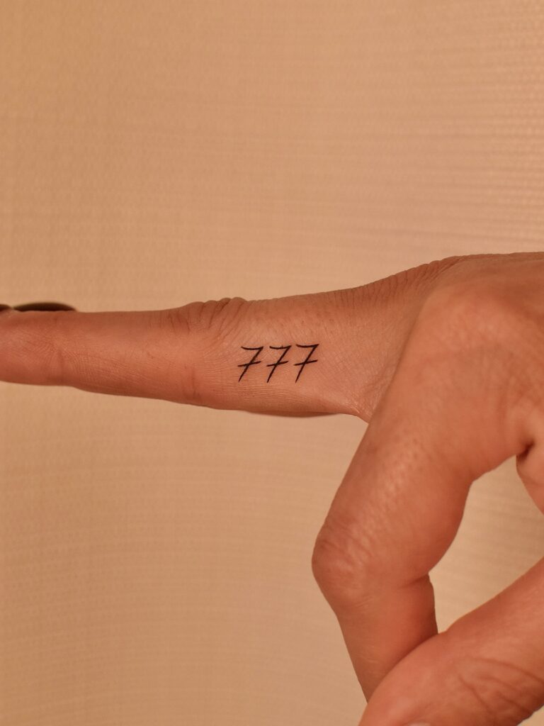 Minimal Flower And Dot Finger Tattoos