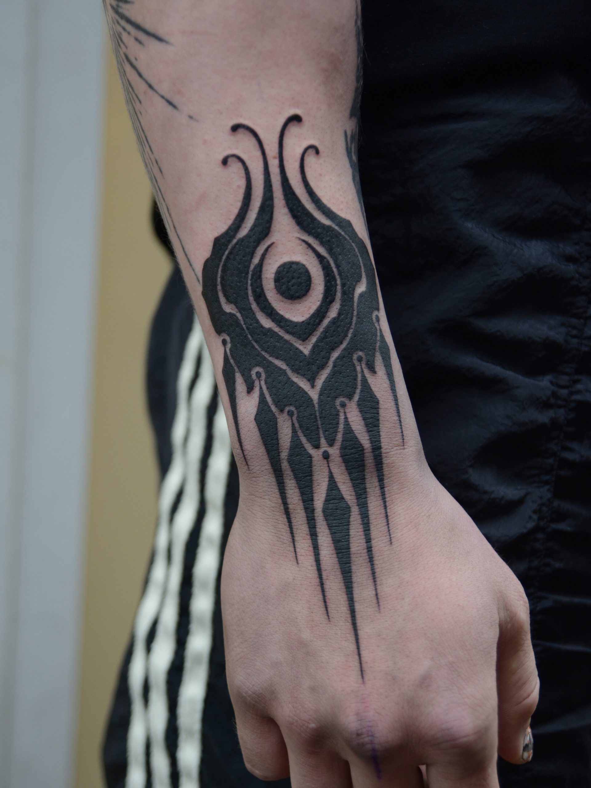 Abstract Blackwork Wrist Tattoo