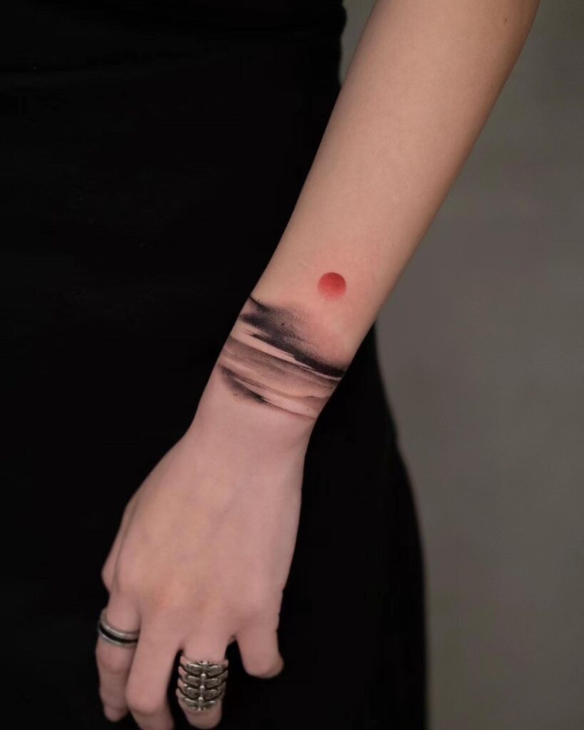 Leo Sunburst Wrist Tattoo