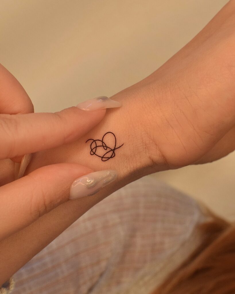 Abstract Single Heart Line Tattoo meaningful tiny tattoos tattoo