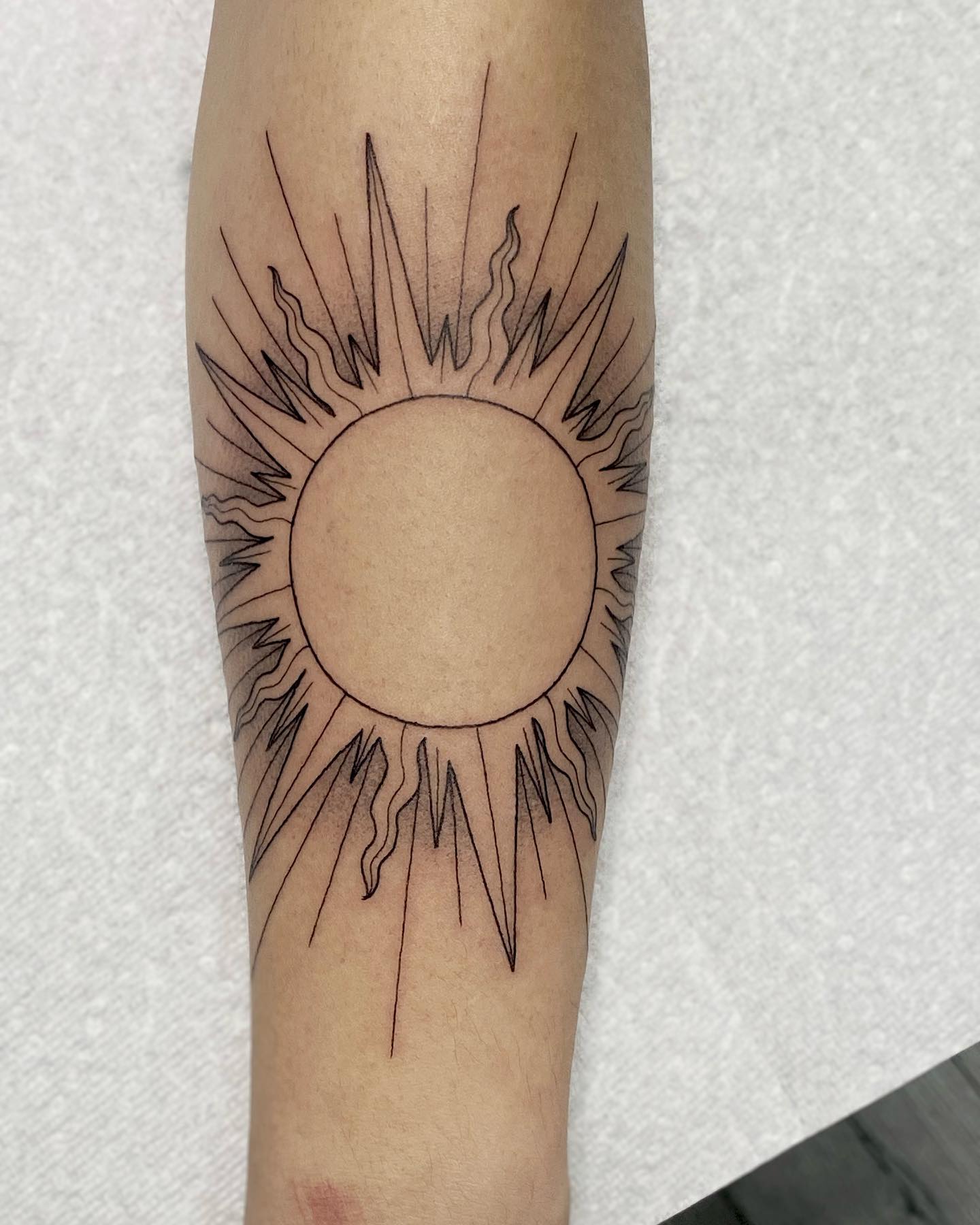 Ornamental Oval Sun Face Tattoo sun tattoos ideas tattoo