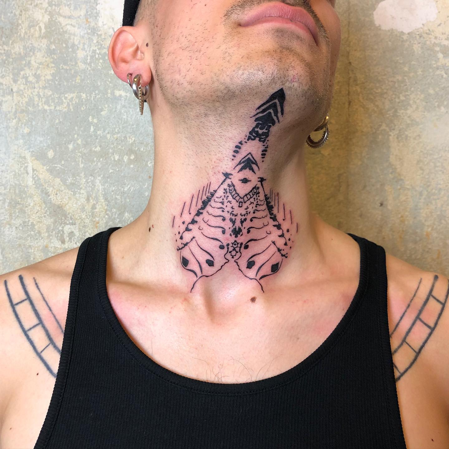 Abstract Symmetrical Neck Tattoo