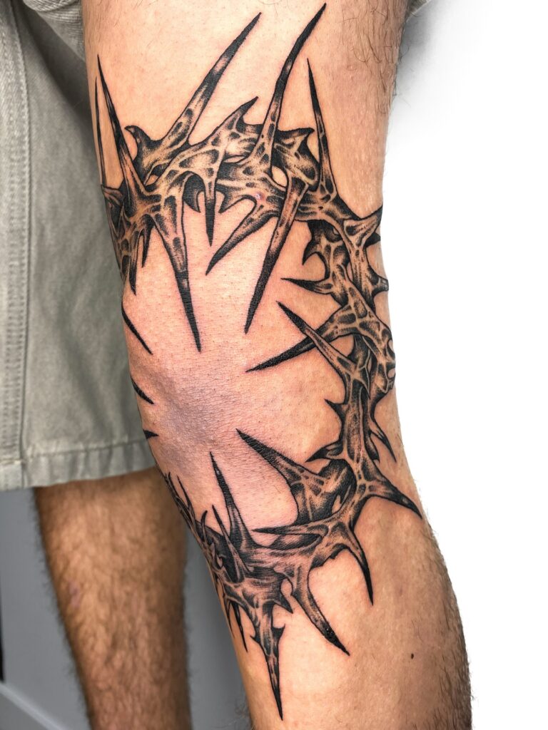 Laurel Wreath Knee Frame Tattoo