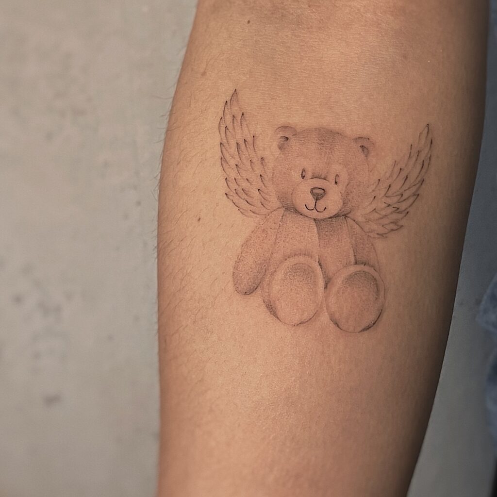 Mother Holding Angel Baby Tattoo