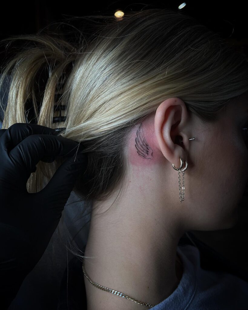 Soft Pink Blossoms Behind-the-Ear Tattoo behind the ear tattoos tattoo