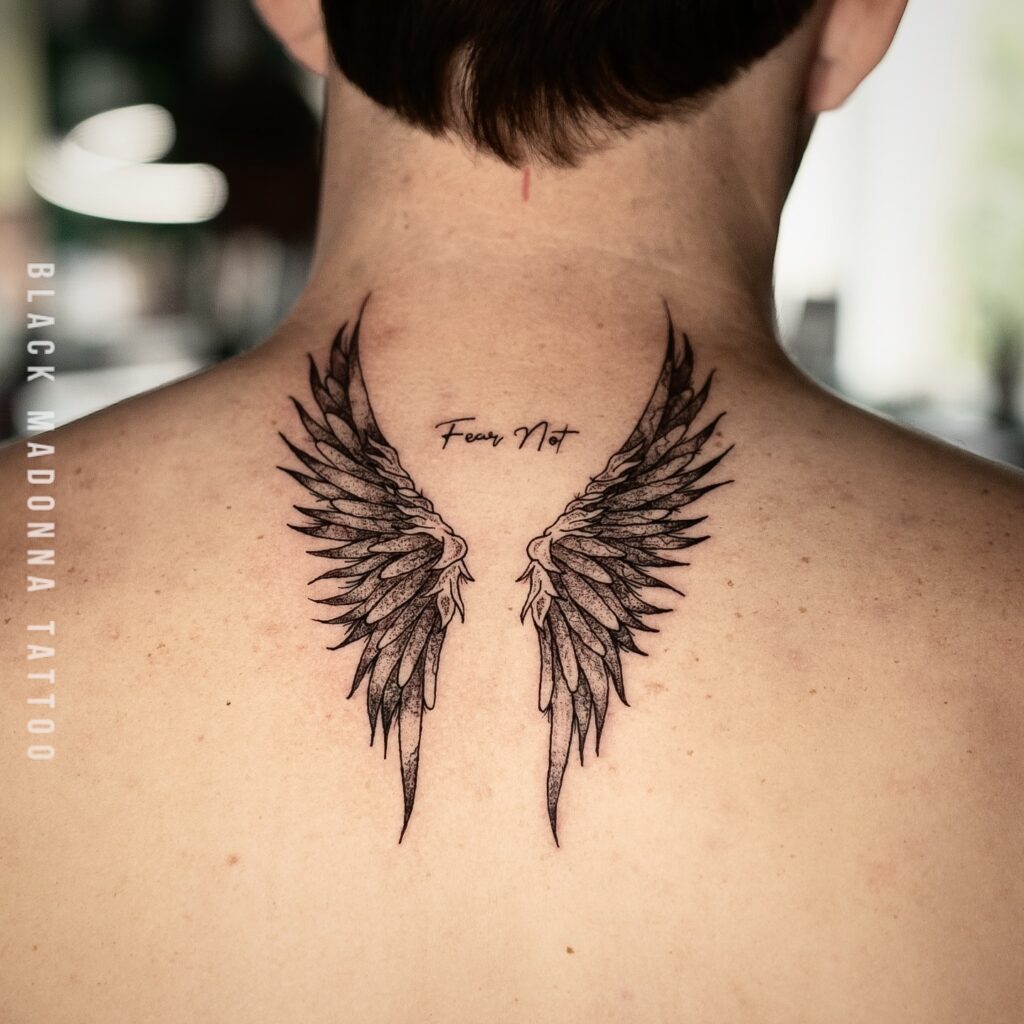 Fear Not Upper Back Wing Tattoo angel wings tattoo ideas on back tattoo