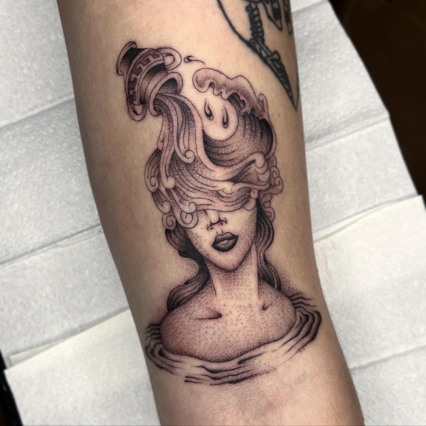 Aquarius Wave Over Eyes Tattoo