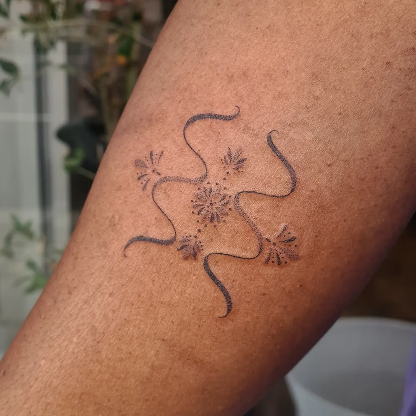 Aquarius Wildflower Glyph Tattoo