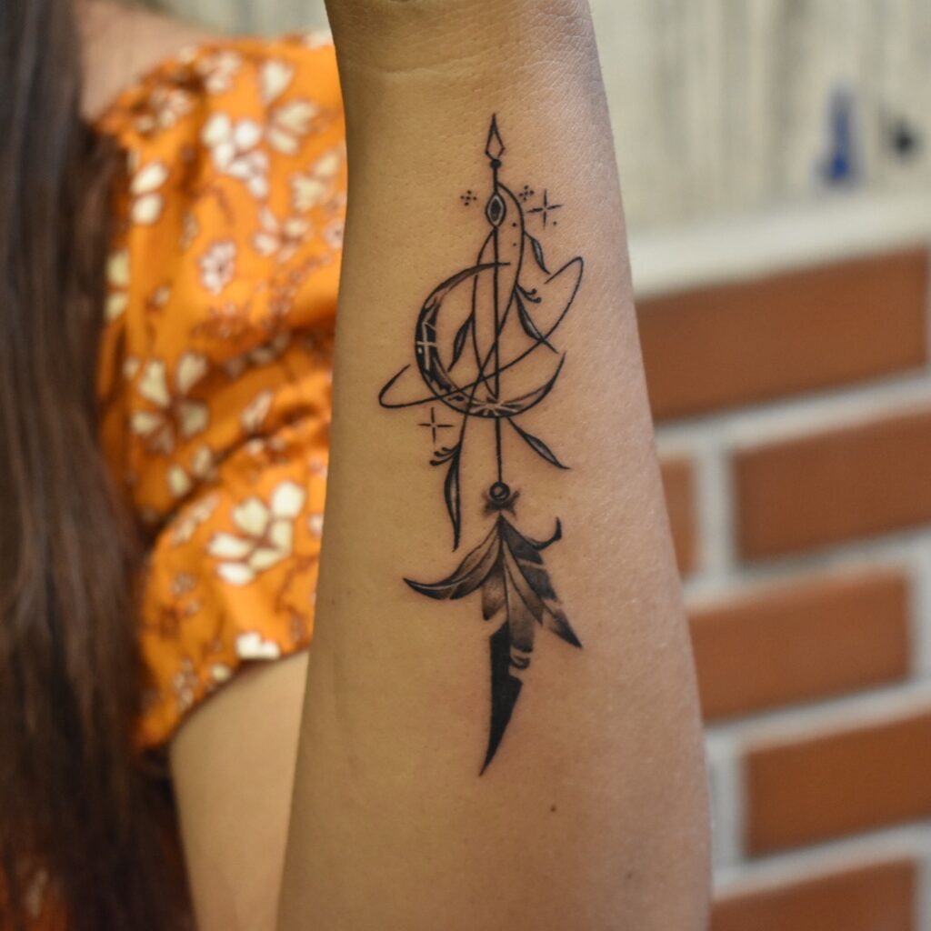 Arrow & Planet Celestial Tattoo meaningful tattoos to check out tattoo