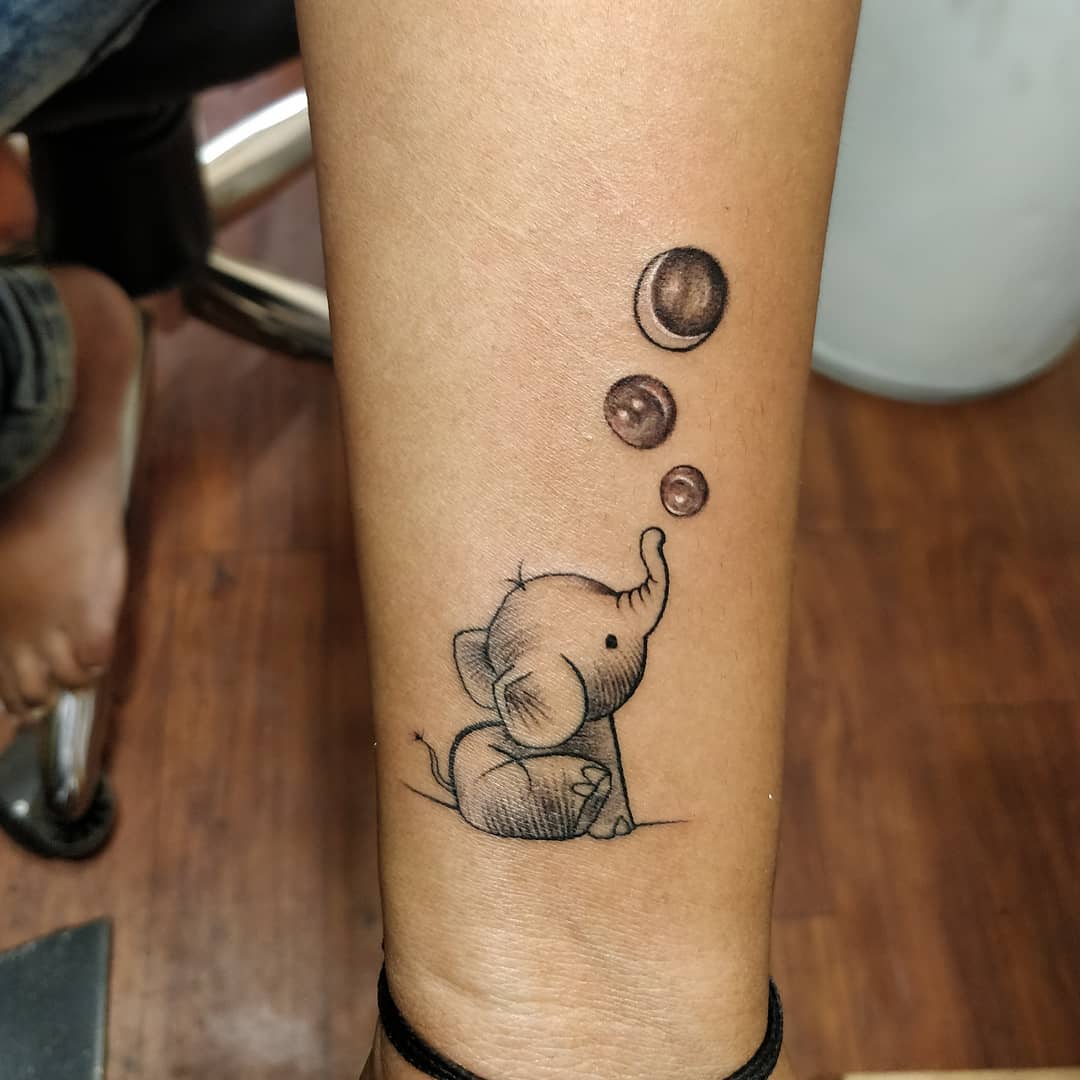 Baby Elephant Blowing Bubbles Tattoo baby elephant tattoo ideas tattoo