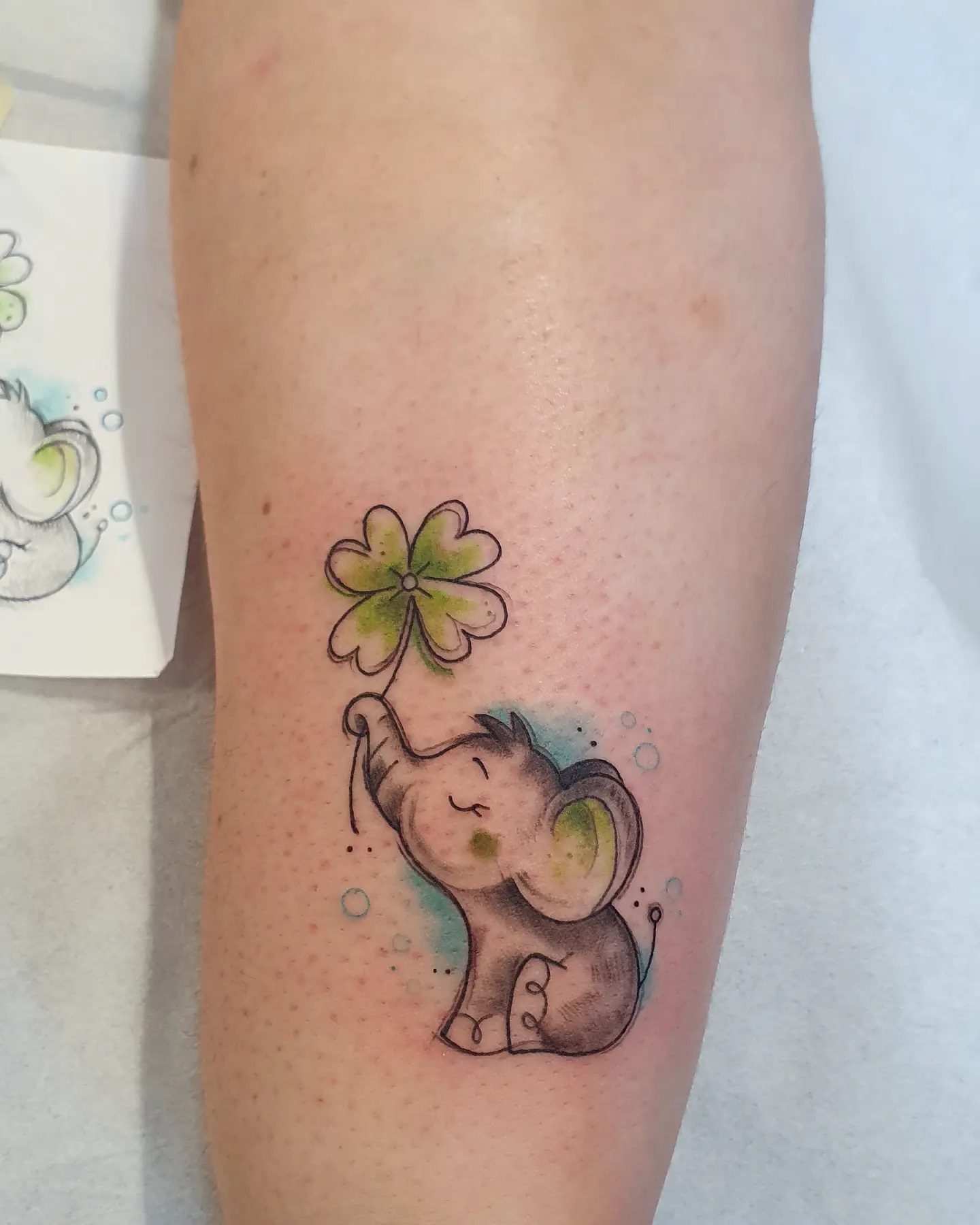 Baby Elephant With Four-Leaf Clover Tattoo baby elephant tattoo ideas tattoo