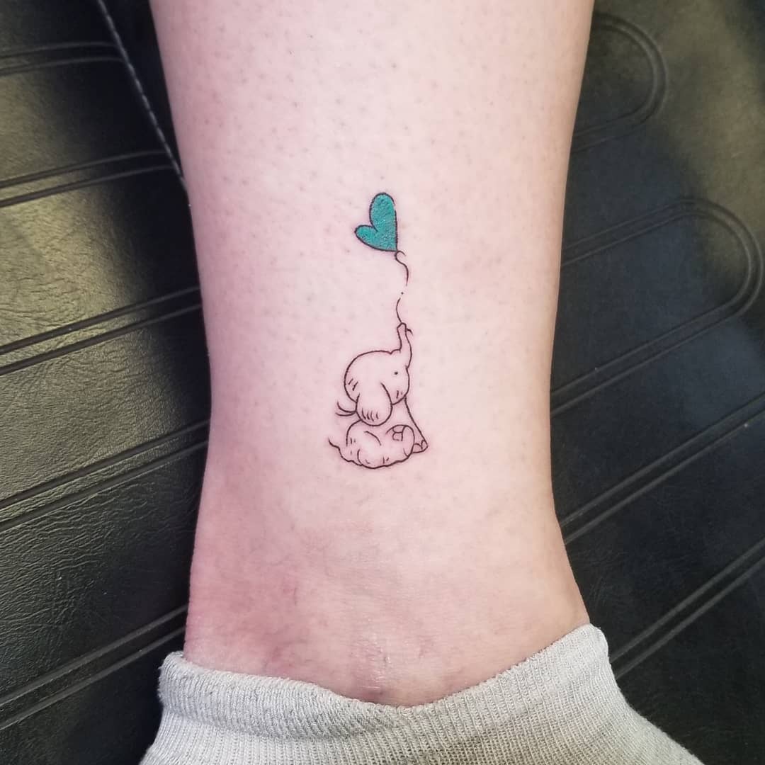 Baby Elephant With Heart Balloon Tattoo baby elephant tattoo ideas tattoo