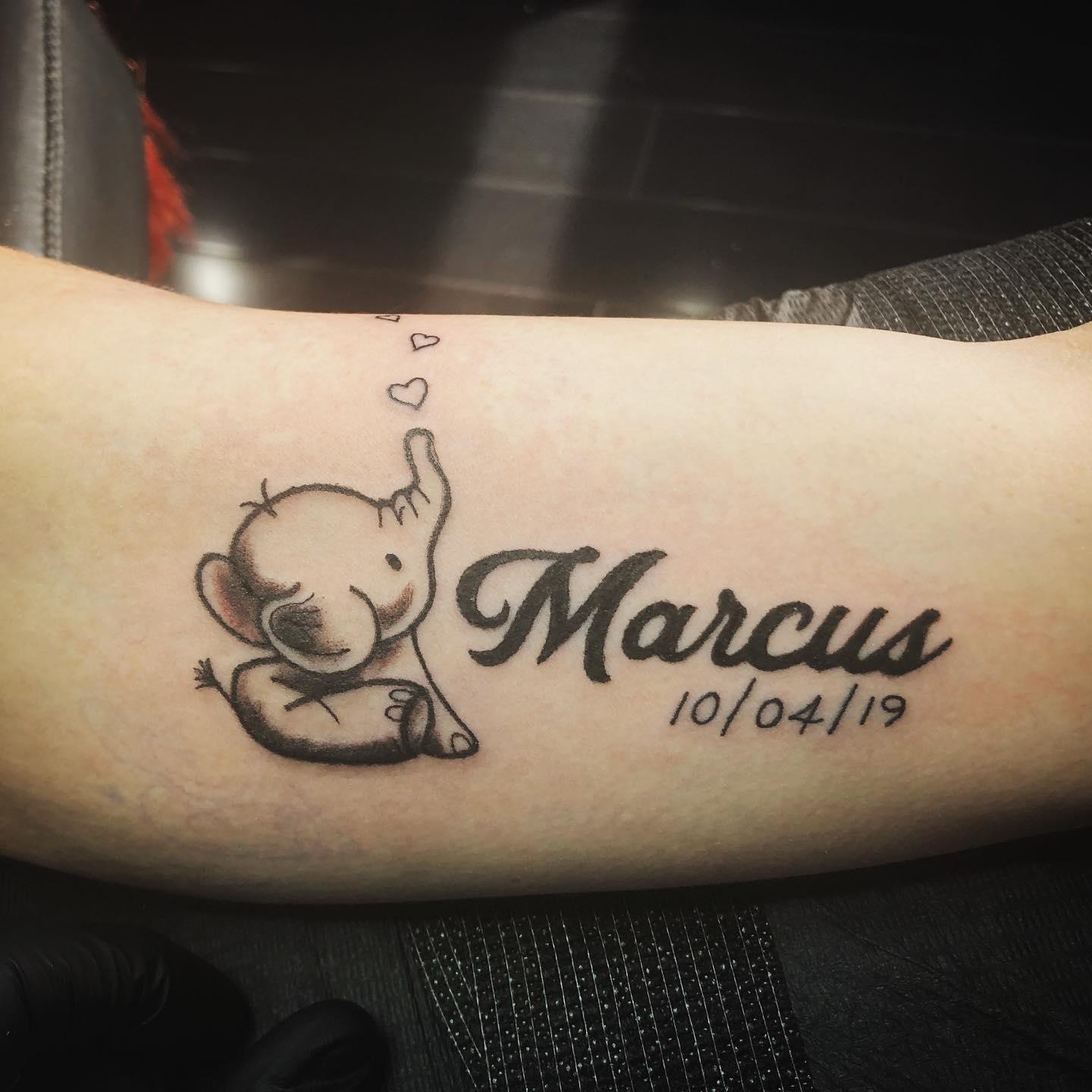 Baby Elephant With Name and Date Tattoo baby elephant tattoo ideas tattoo