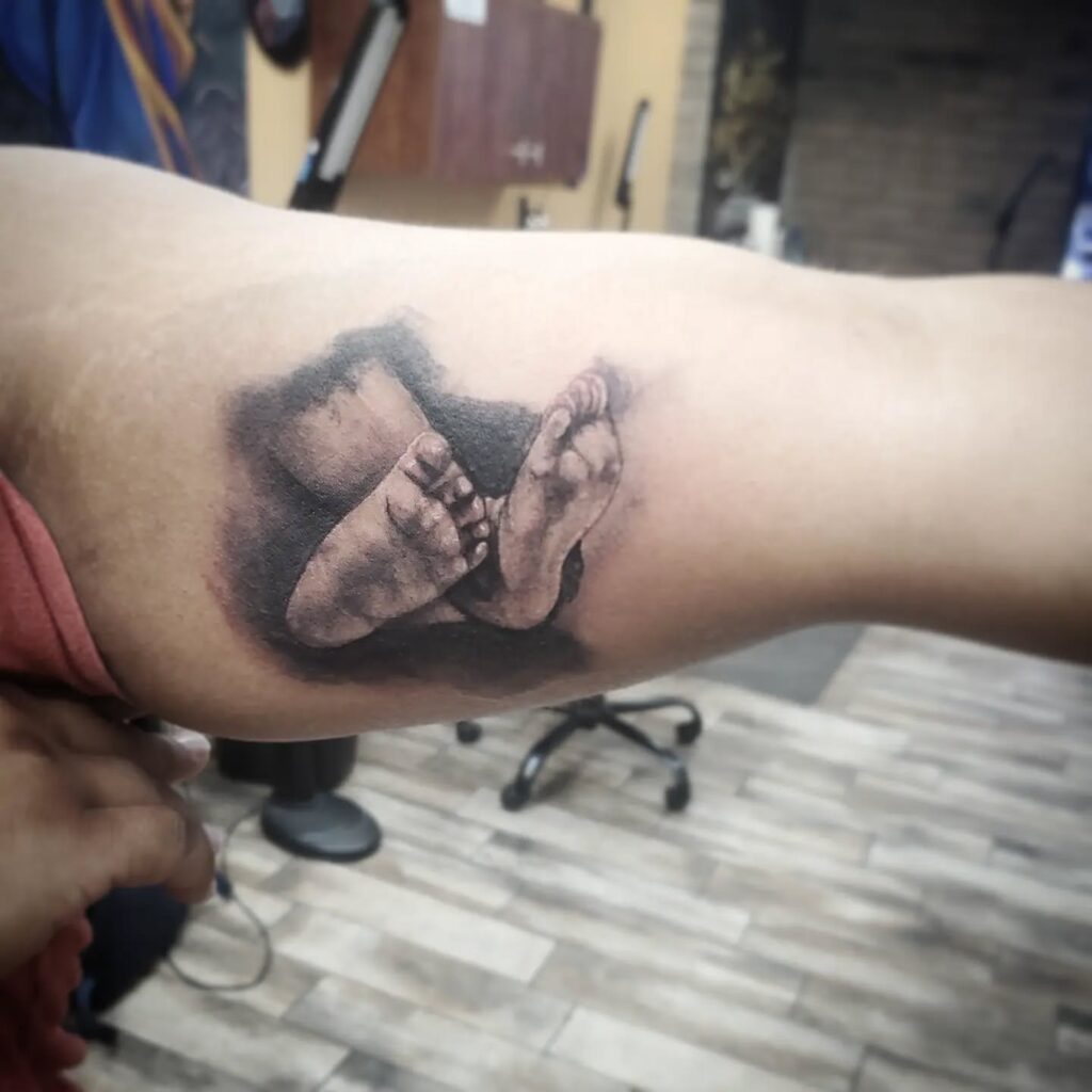 Baby Feet in Gentle Embrace Tattoo baby feet tattoos tattoo