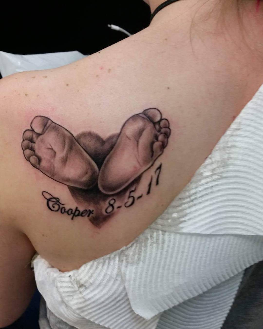 Baby Footprints With Floral Tattoo baby feet tattoos ideas tattoo