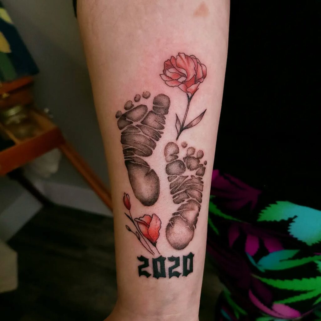 Baby Footprints with Floral Accents Tattoo baby feet tattoos tattoo