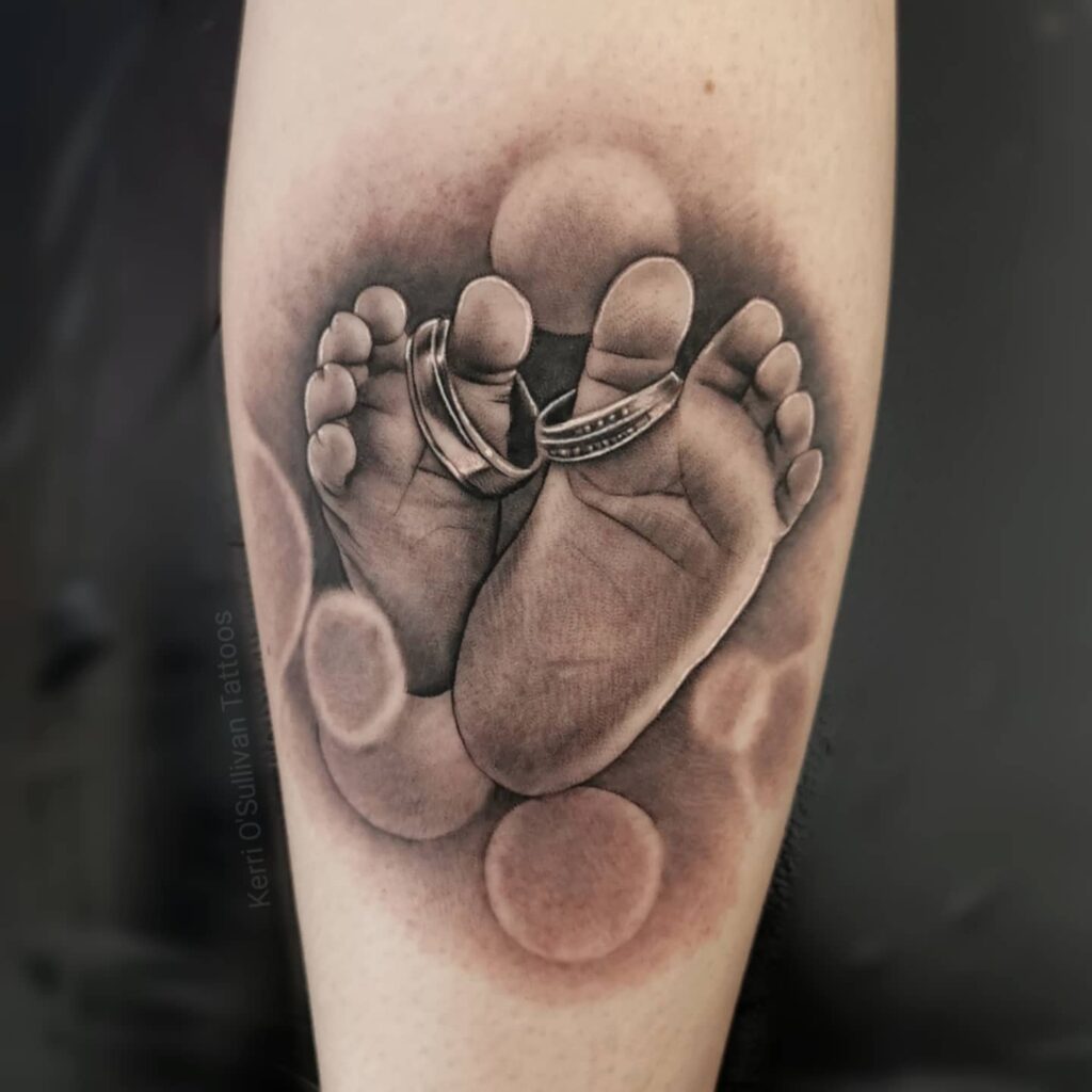 Baby Footprints With Rings Tattoo baby feet tattoos tattoo