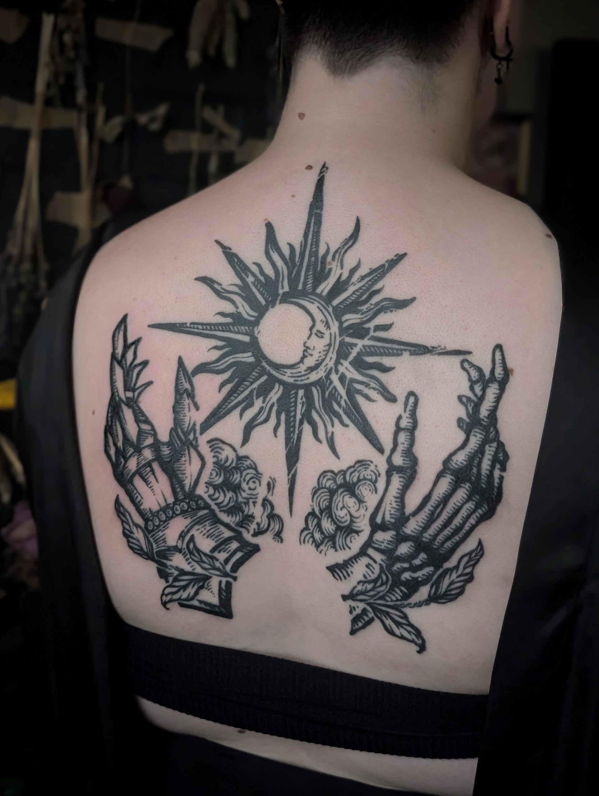 Sun Moon And Praying Skeleton Hands Back Tattoo