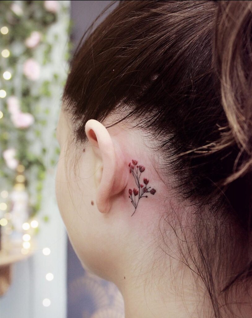 Behind-the-Ear Floral Tattoo minimal tiny flower tattoo ideas tattoo