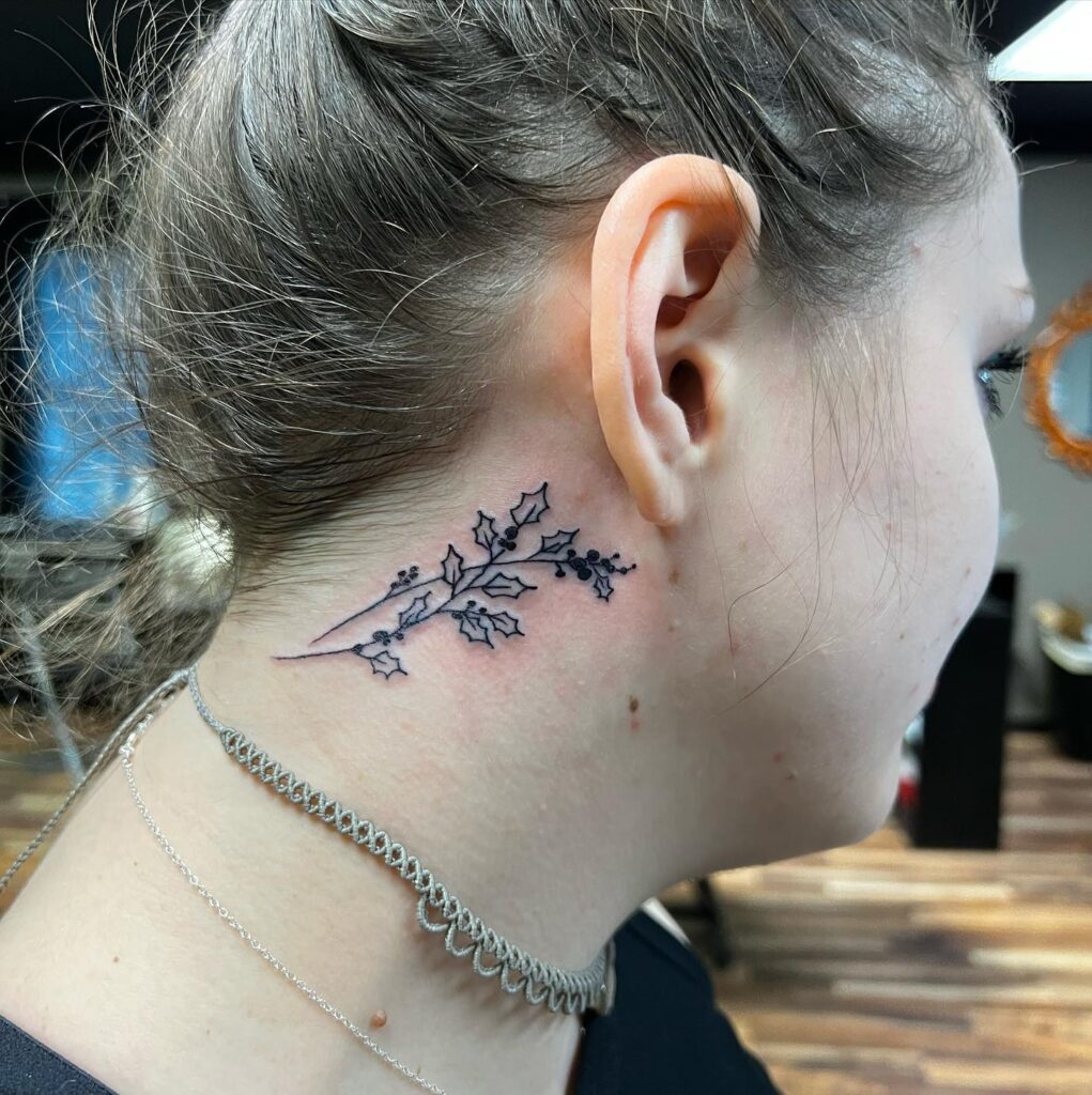 Behind-the-Ear Holly Sprig Tattoo december birth flower tattoo ideas tattoo