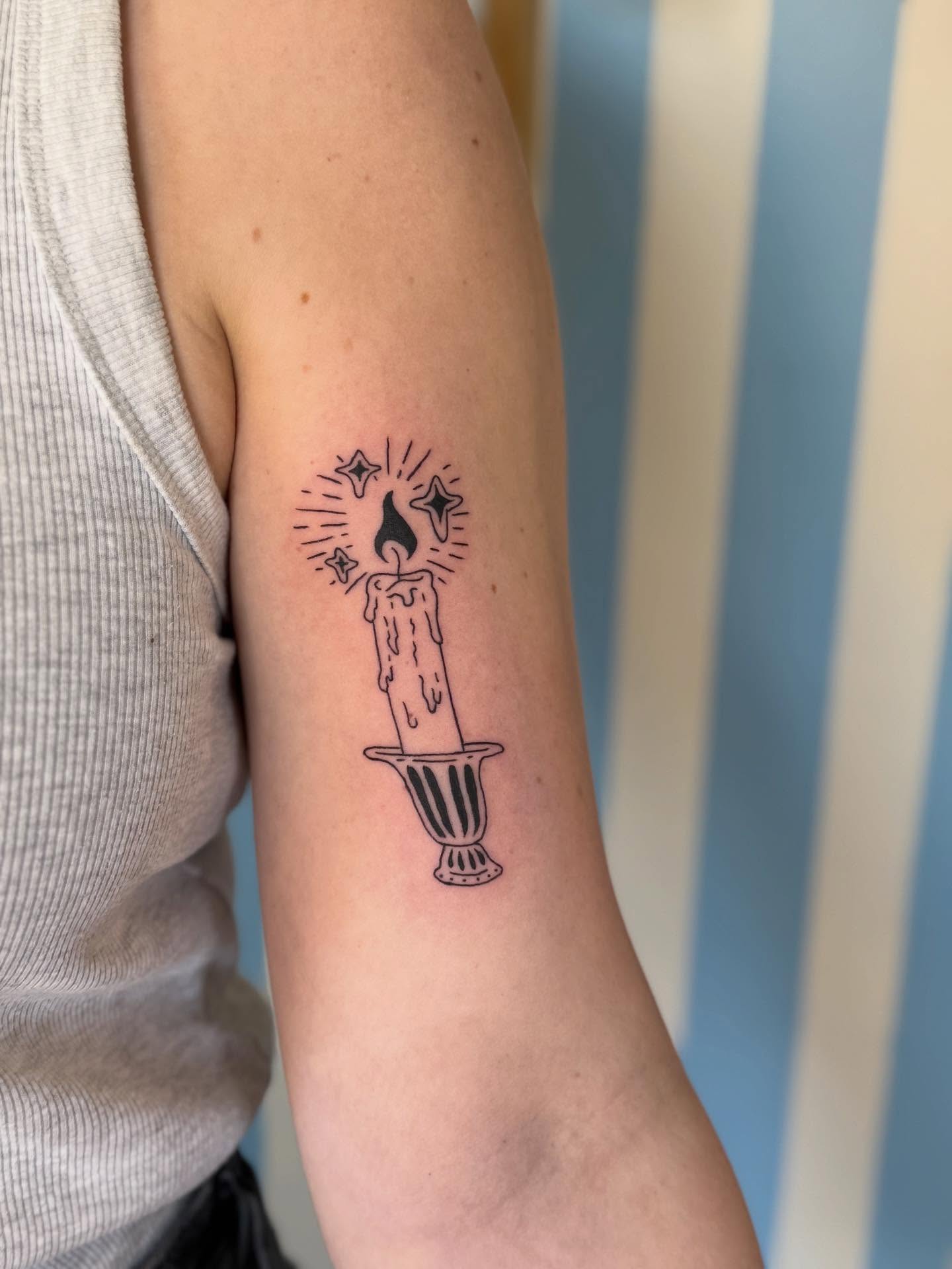 Glowing Candle Bicep Tattoo