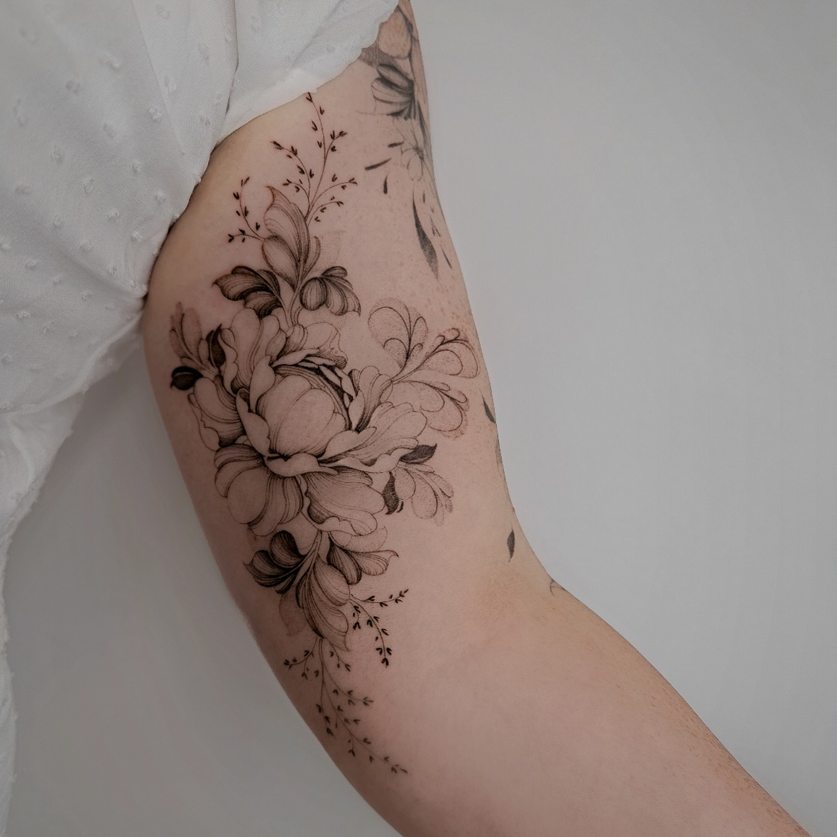 Ornamental Peony Floral Bicep Tattoo
