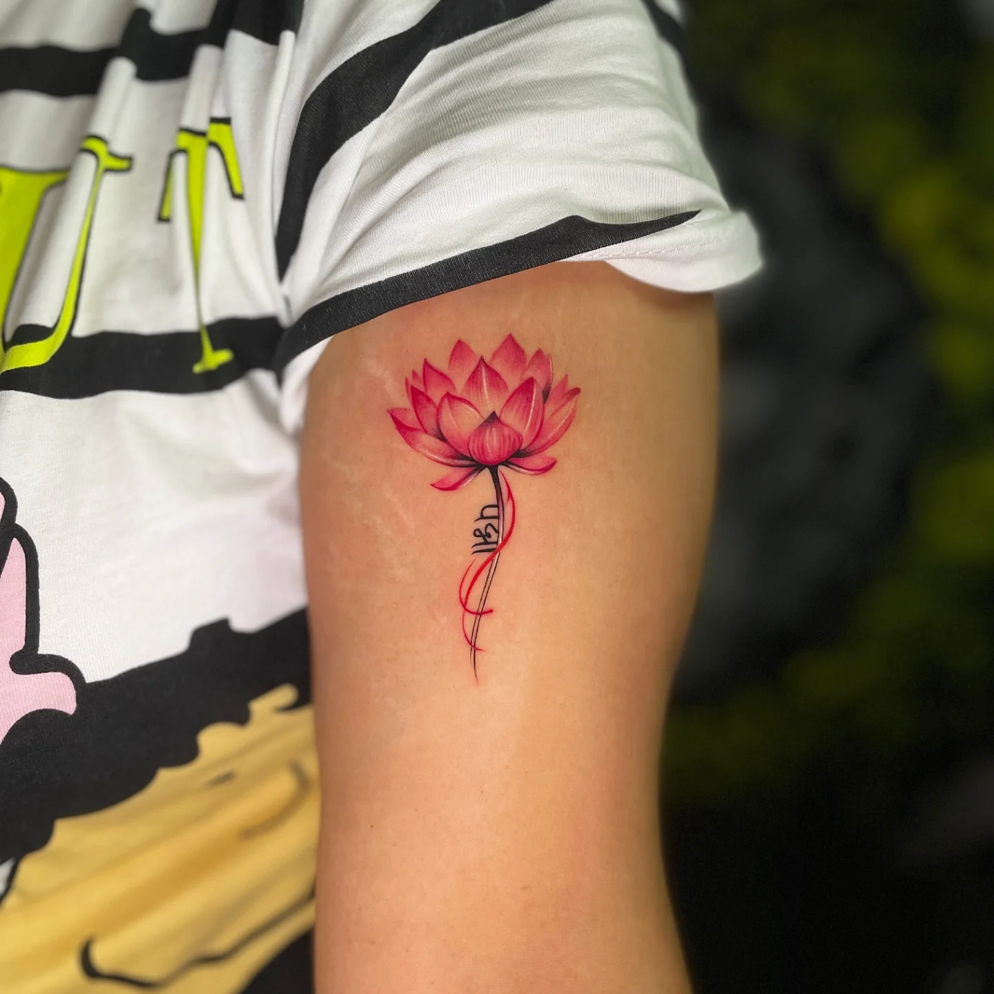 Pink Lotus Flower Bicep Tattoo