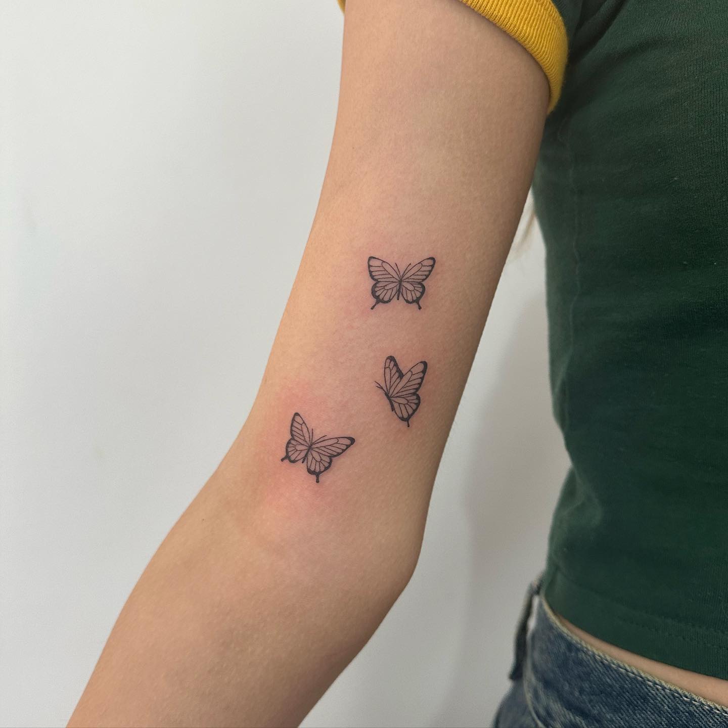 Three Butterflies Bicep Tattoo