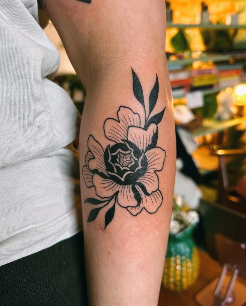 Black and Gray Peony Tattoo with Minimalist Detailing peony flower tattoo ideas tattoo