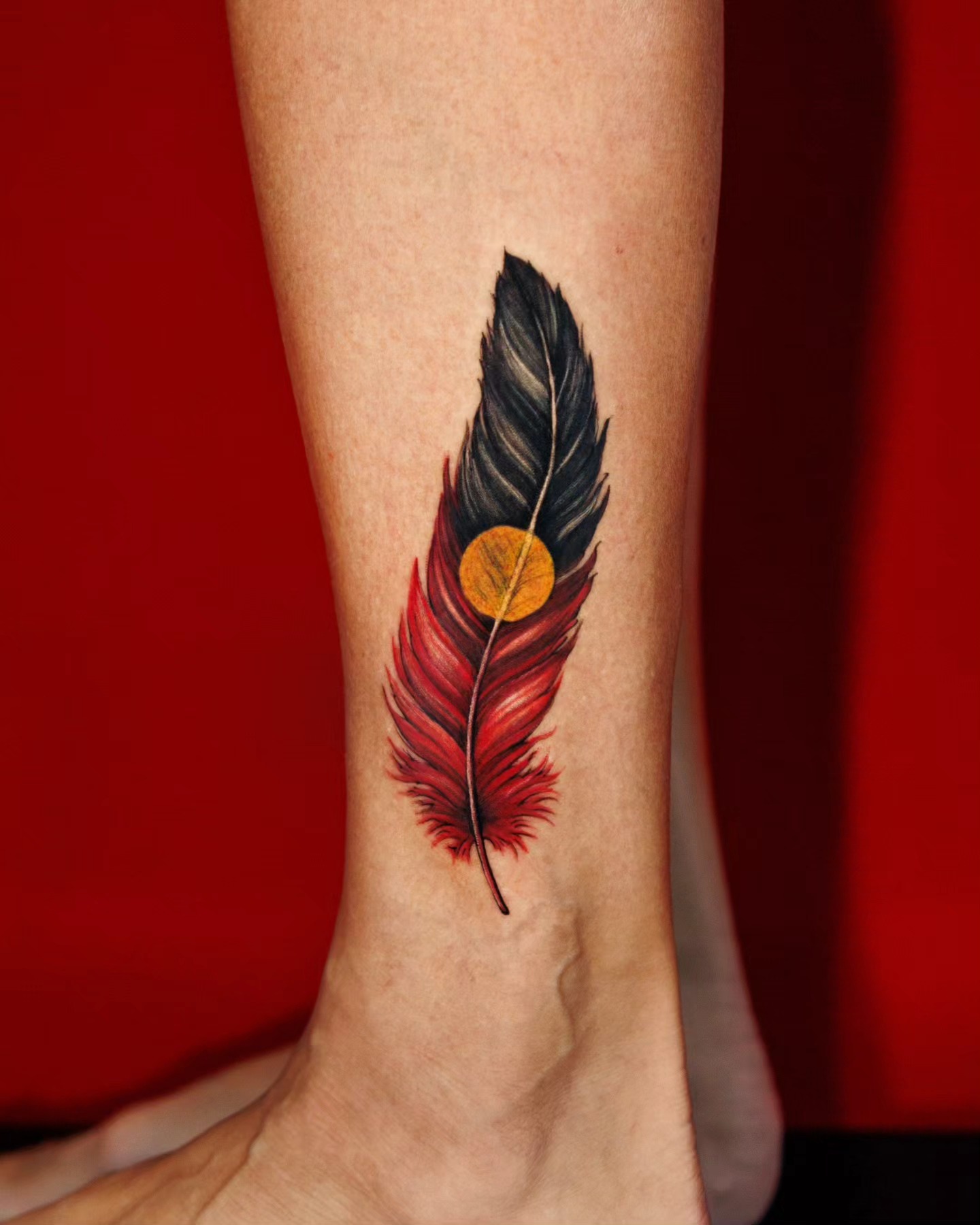 Feather And Guiding Star Tattoo