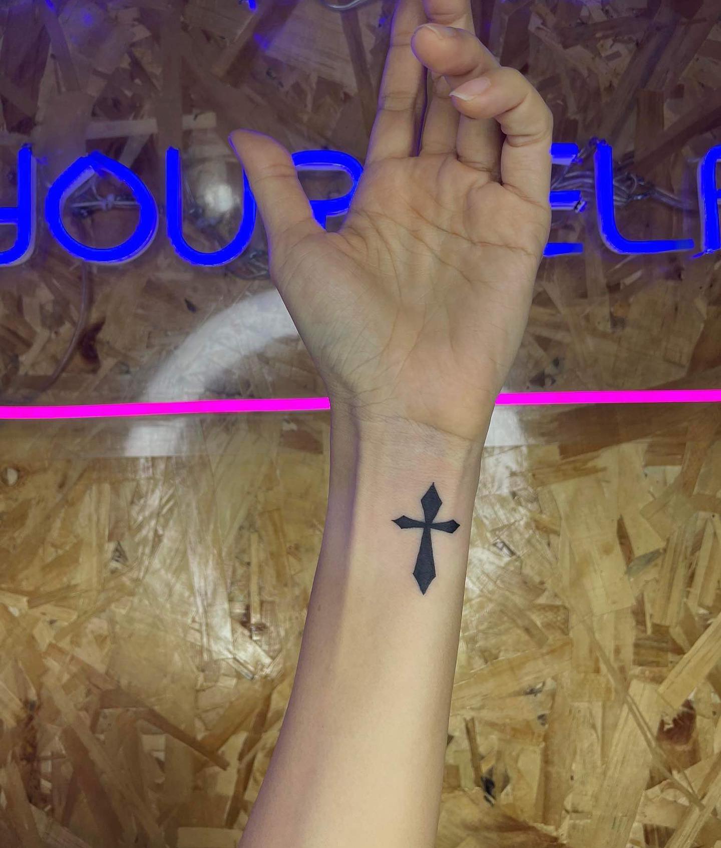 Black Cross Wrist Tattoo