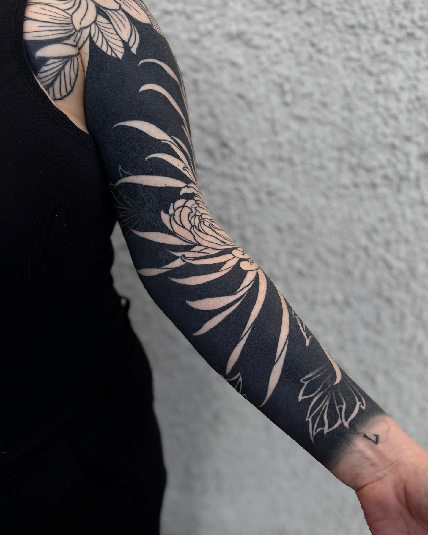 Blackwork Floral Negative Space Sleeve Tattoo