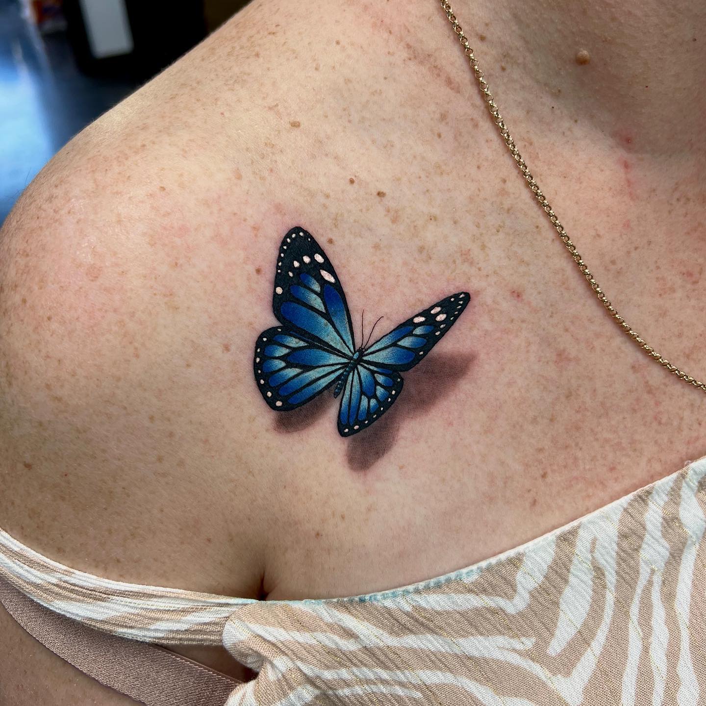 Blue Butterfly Collarbone Tattoo butterfly tattoos designs tattoo