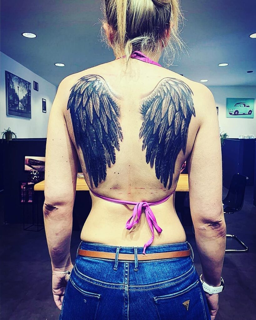 Bold Black Angel Wings Tattoo on Back angel wings tattoo ideas on back tattoo
