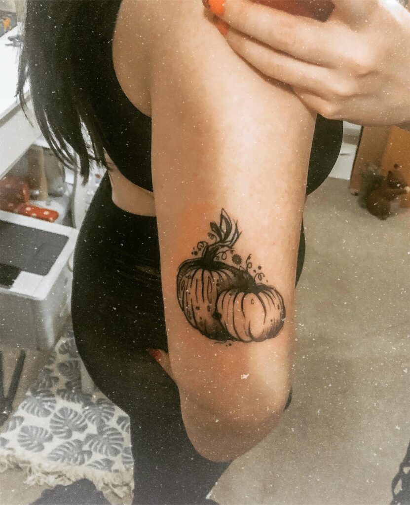 Cute Pumpkin With Flower Accent Tattoo Design