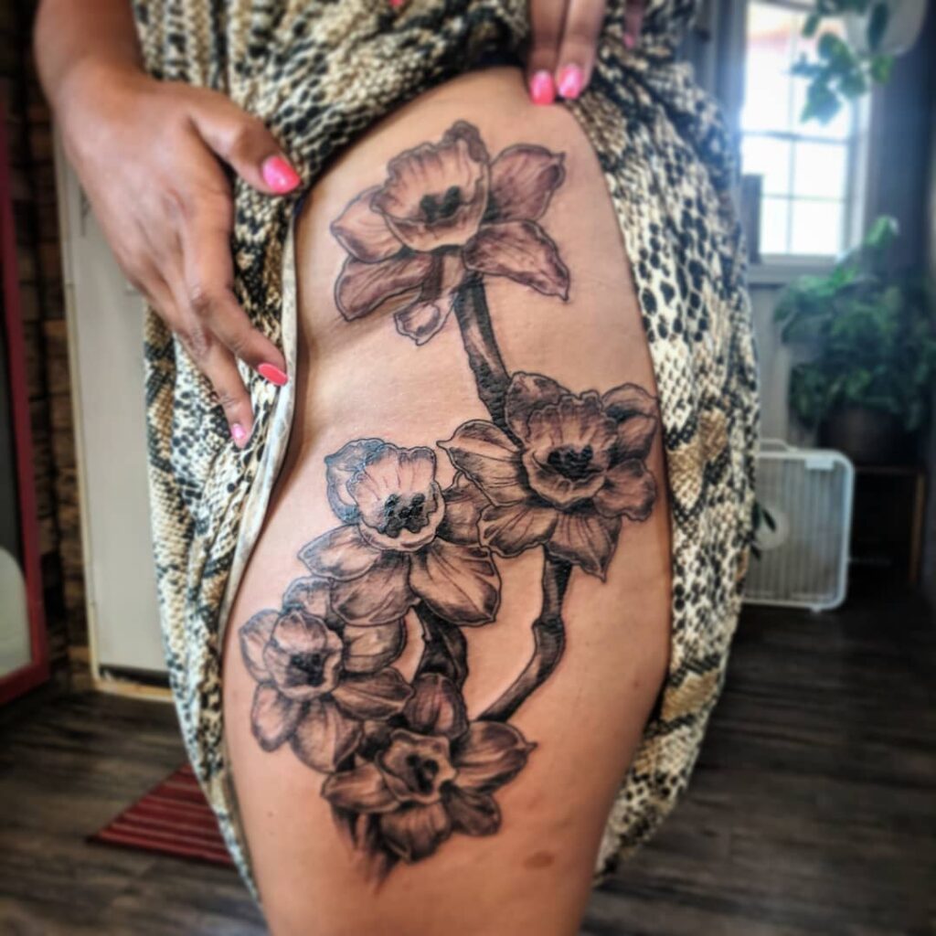 Bold Blackwork Narcissus Thigh Tattoo december birth flower tattoo ideas tattoo