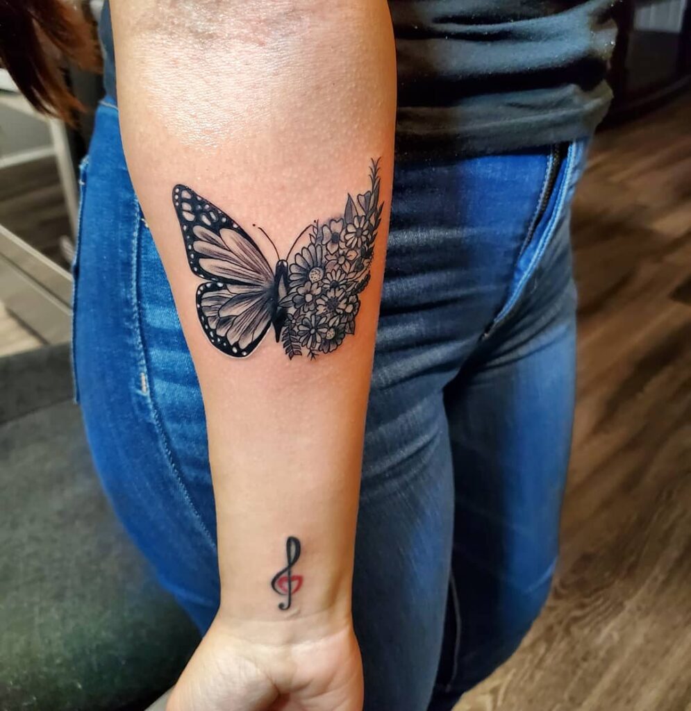Bold Contrast Butterfly and Floral Forearm Tattoo half butterfly half flower tattoos tattoo