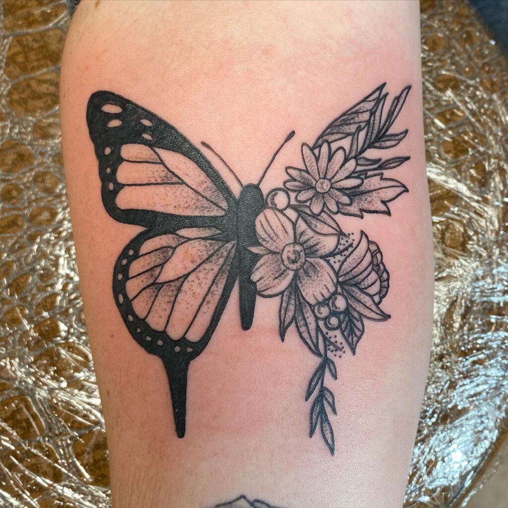 Bold Contrast Butterfly and Floral Tattoo half butterfly half flower tattoos tattoo