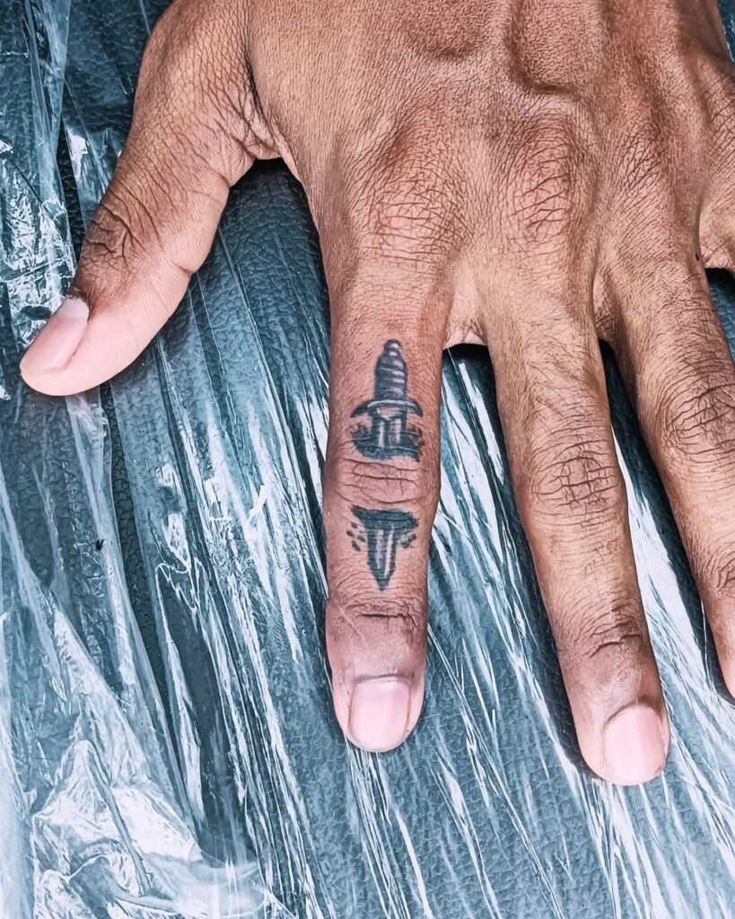 Minimalist Branch Finger Tattoo