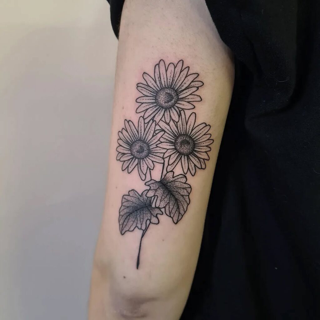 Bold Dotwork Daisy Tattoo april birth flower tattoo ideas tattoo