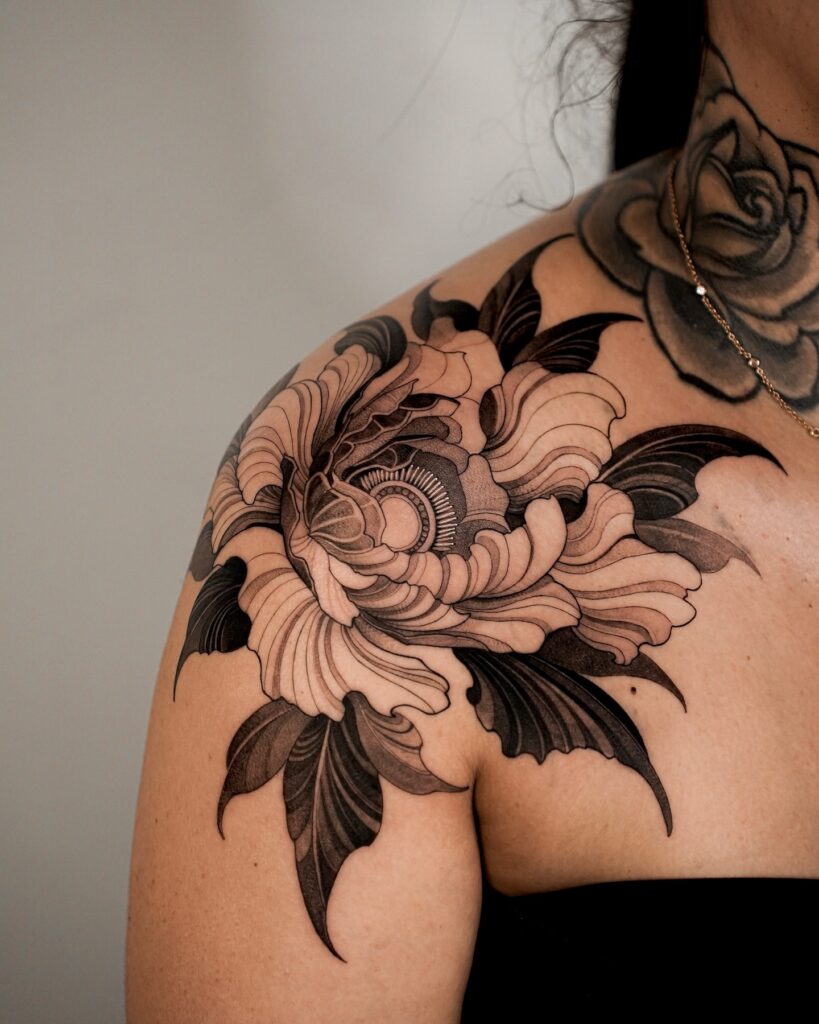 Bold Japanese-Inspired Peony Shoulder Tattoo women shoulder flower tattoo ideas tattoo