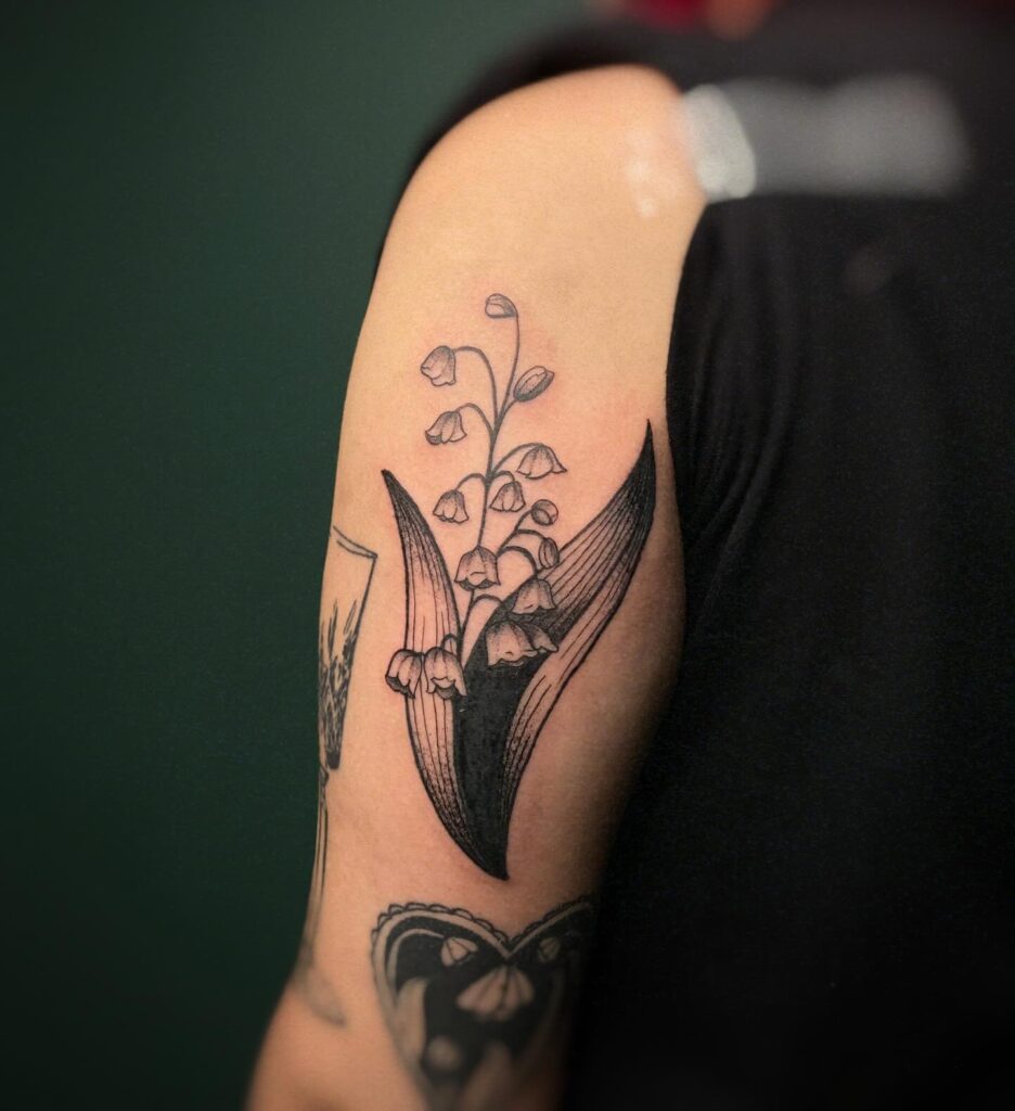 Bold Lily of the Valley Upper Arm Tattoo may birth flower tattoos tattoo