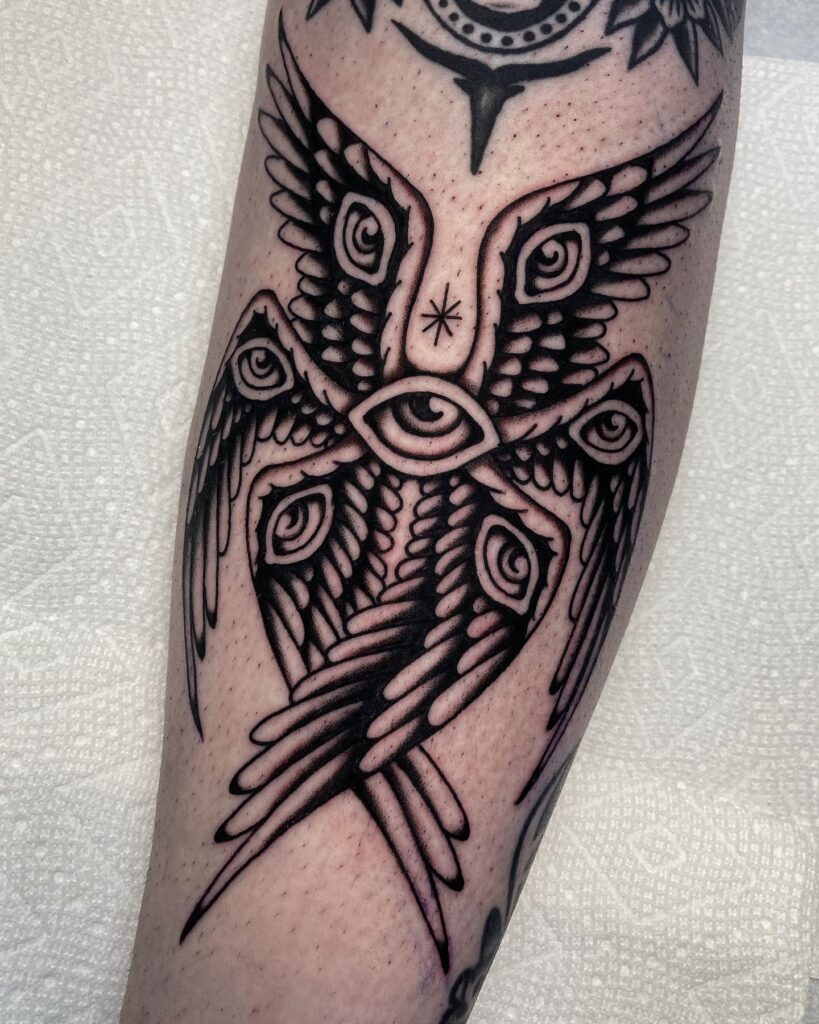 Bold Linework Seraphim Tattoo with Spiral Eyes seraphim angel tattoo ideas tattoo